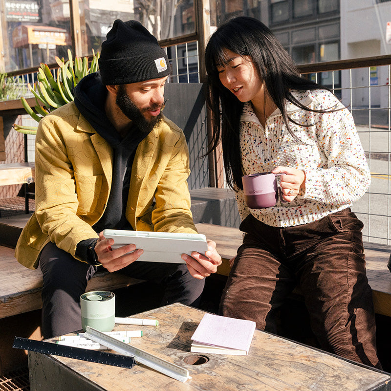 12oz-rise-mug-t9 12oz_rise_coffee_mug_dusty_orchid_couple_city_patio_square.jpg
