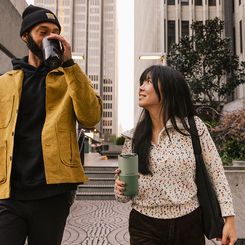bring-your-own-party-kit-pints-and-tumblers-c7 16oz_rise_tumbler_black_iceberg_couple_drink_city_street_square.jpg