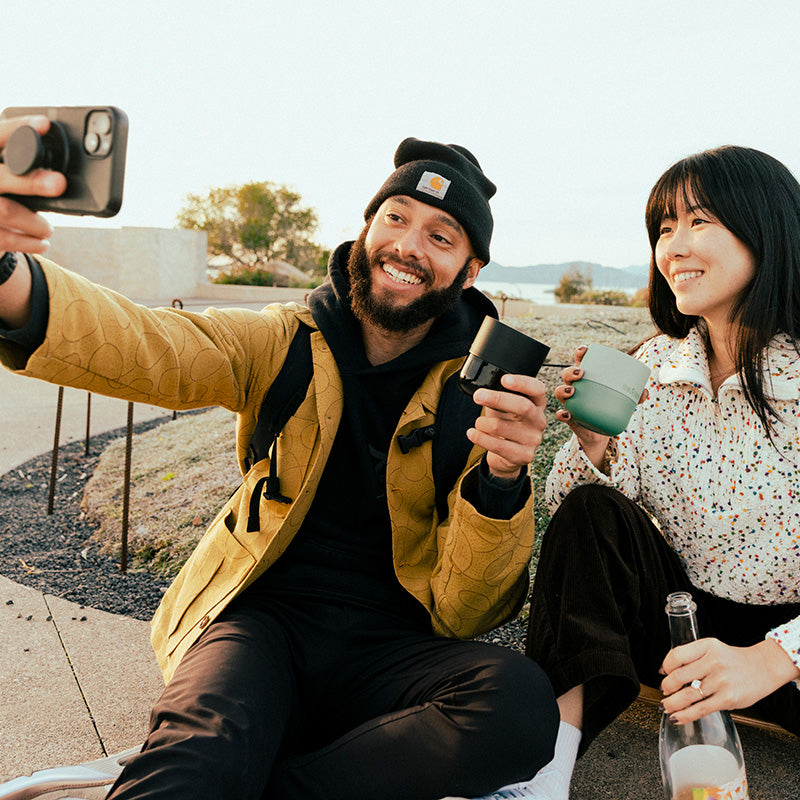 bring-your-own-party-kit-tumblers-and-cocktails-z8 8oz_rise_lowball_black_iceberg_couple_selfie_city_square.jpg