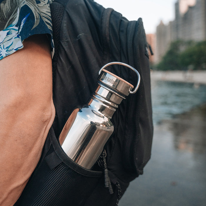 27oz-reflect-with-bamboo-cap-g6 K27SSLRF-MS-BAMBOO_reflect-bottle_backpack_lifestyle.jpg